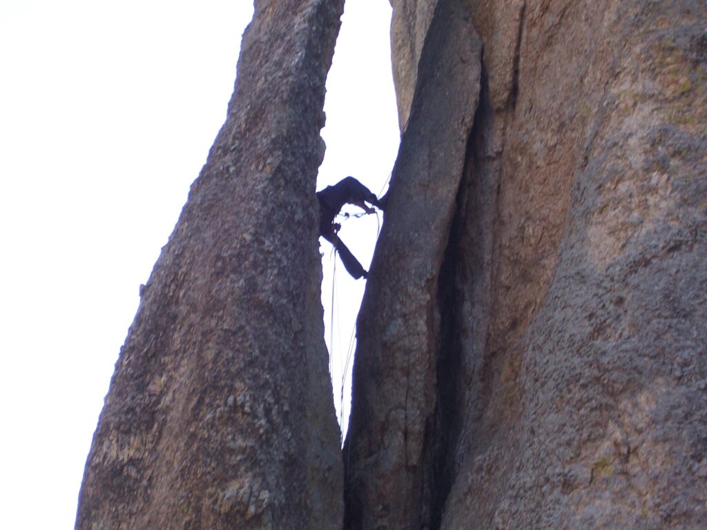 photo-silhouette-of-climber-in-eye-of-the-needle-sd